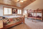 Eagle Trail Lodge bedroom with a queen and bunk beds.  